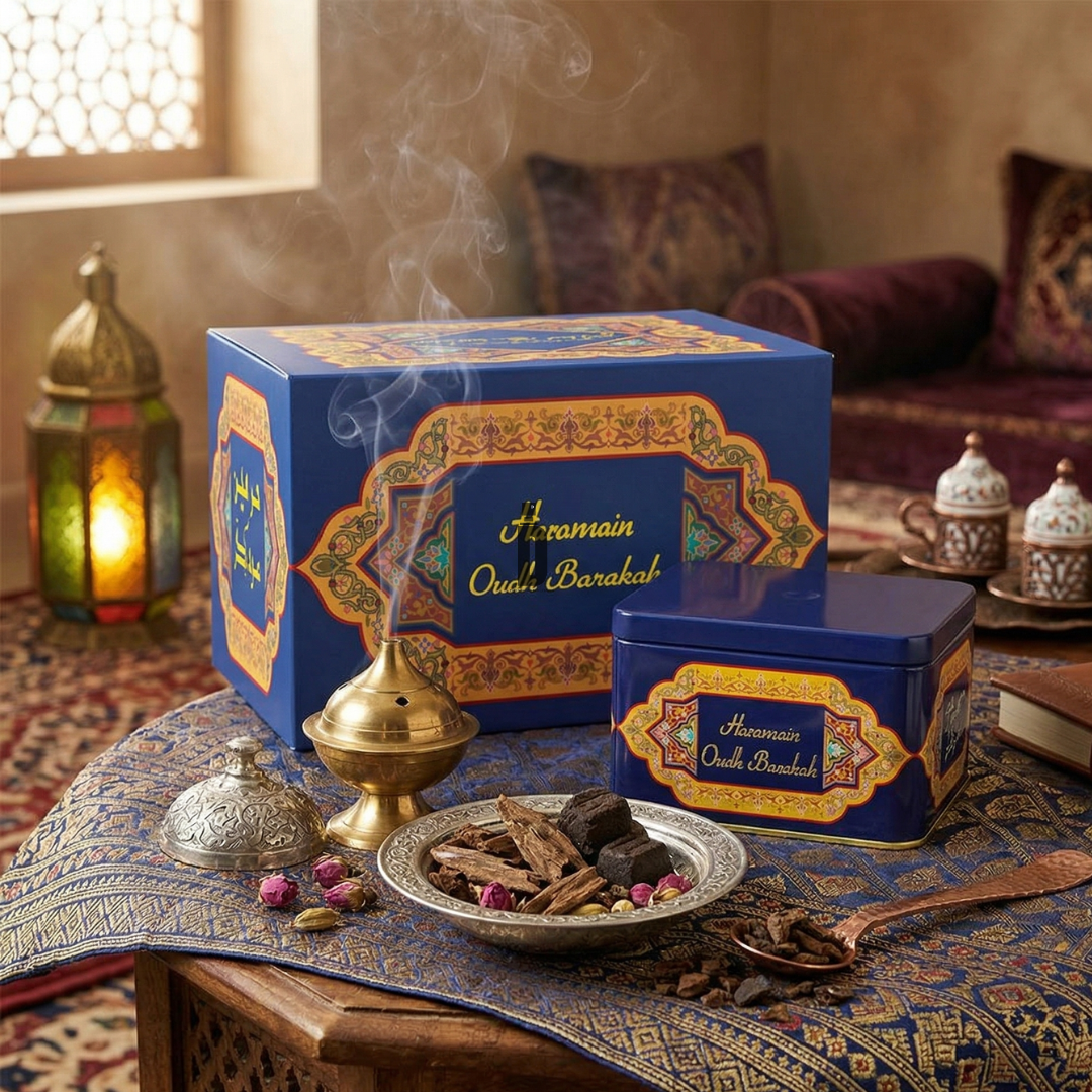 An ornate tin of Oudh Barakah Bakhoor 40g by Al Haramain rests on a patterned tablecloth beside a smoking incense burner and teacups, infusing the cozy Middle Eastern-style room with a rich, enduring fragrance.
