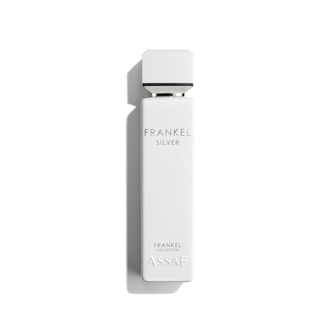 A tall, rectangular white bottle with a square cap for Assaf’s Frankel Silver 200ml EDP. "FRANKEL SILVER" is printed near the top, "FRANKEL COLLECTION ASSAF" near the base—perfect for sandalwood musk lovers. Shadow falls to the left.