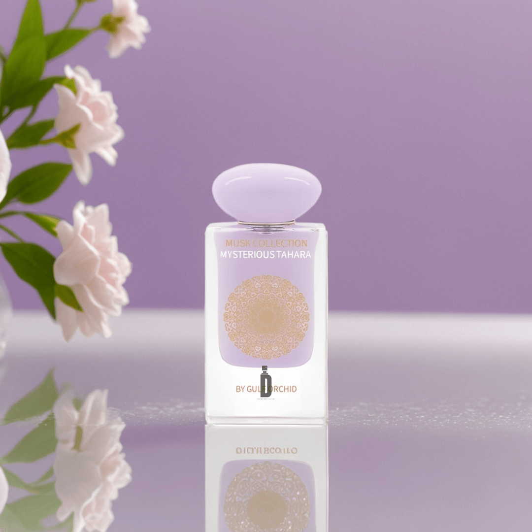 The Gulf Orchid Musk Collection Mysterious Tahara 60ml EDP stands on a reflective surface with soft pink flowers and a lavender background, evoking an elegant and pure atmosphere that reflects the warmth of its signature musk fragrance.