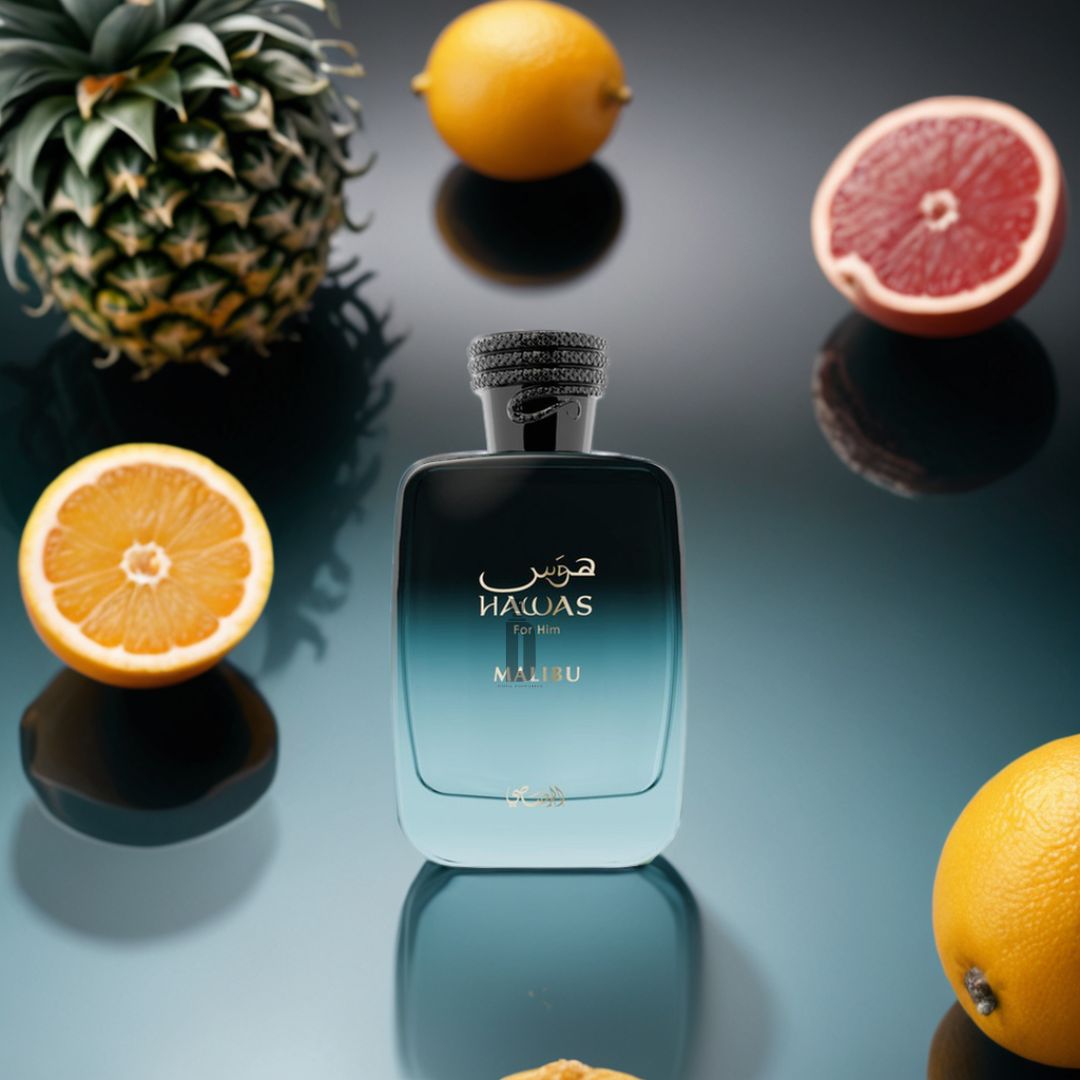 The "Hawas Malibu 100ml EDP" by Rasasi stands among citrus fruits on a glossy surface, evoking the essence of a tropical summer fragrance.