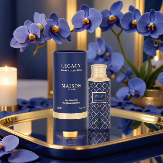The Legacy 100ml EDP by Maison Asrar from Gulf Orchid is showcased elegantly on a gold tray with vibrant blue orchids and candles. The luxurious setting, enhanced by rich blue and gold tones, captures the essence of fragrance with a hint of citrus freshness.