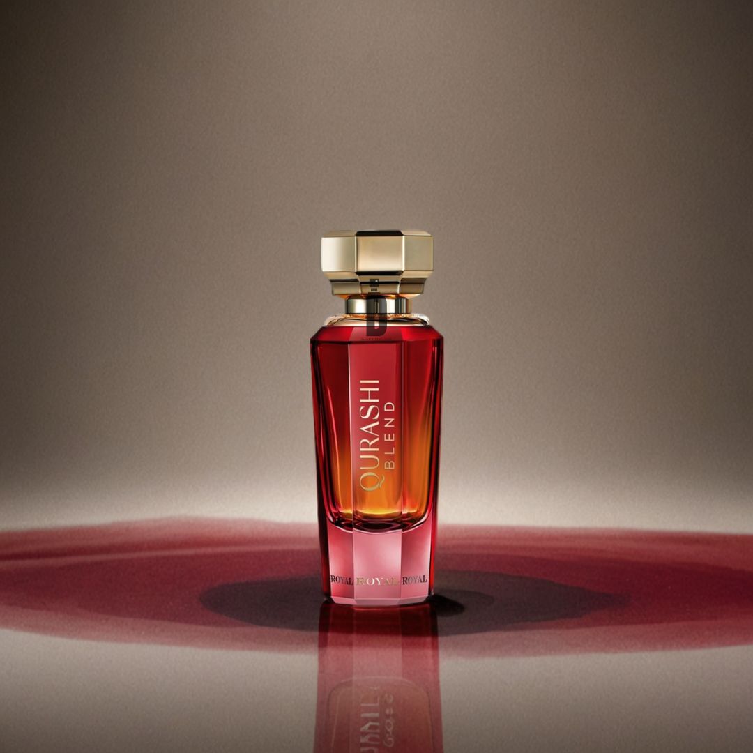 A luxurious glass bottle of Al Qurashi Blend Royal 90ml EDP by Abdul Samad Al Qurashi, topped with a gold cap, stands on a surface beside spilled red liquid under a soft spotlight against a brown gradient background.