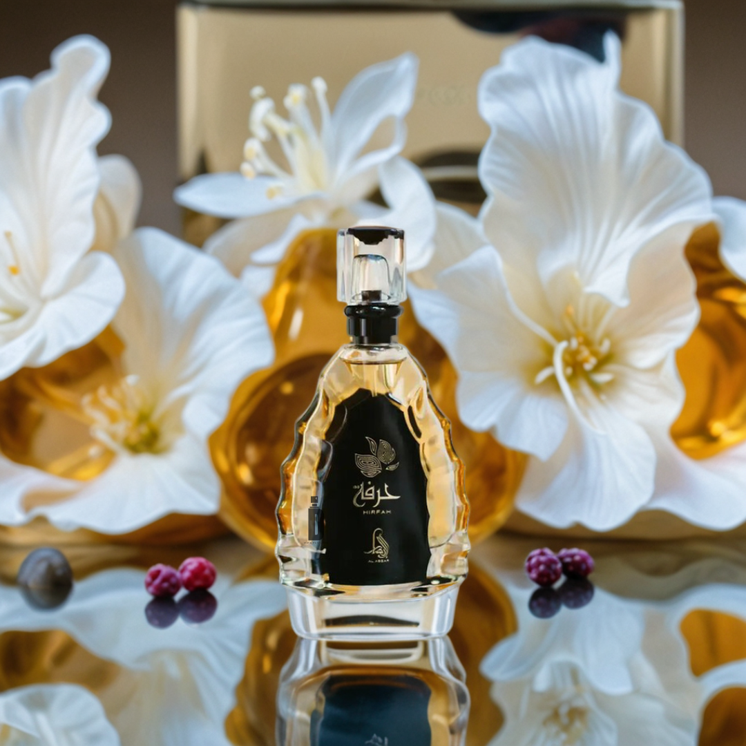 The Hirfah 100ml EDP by Al Absar is showcased in a gold-accented bottle before white blooms and a gold backdrop, with decorative berries on a reflective surface, evoking an elegant floral scent.
