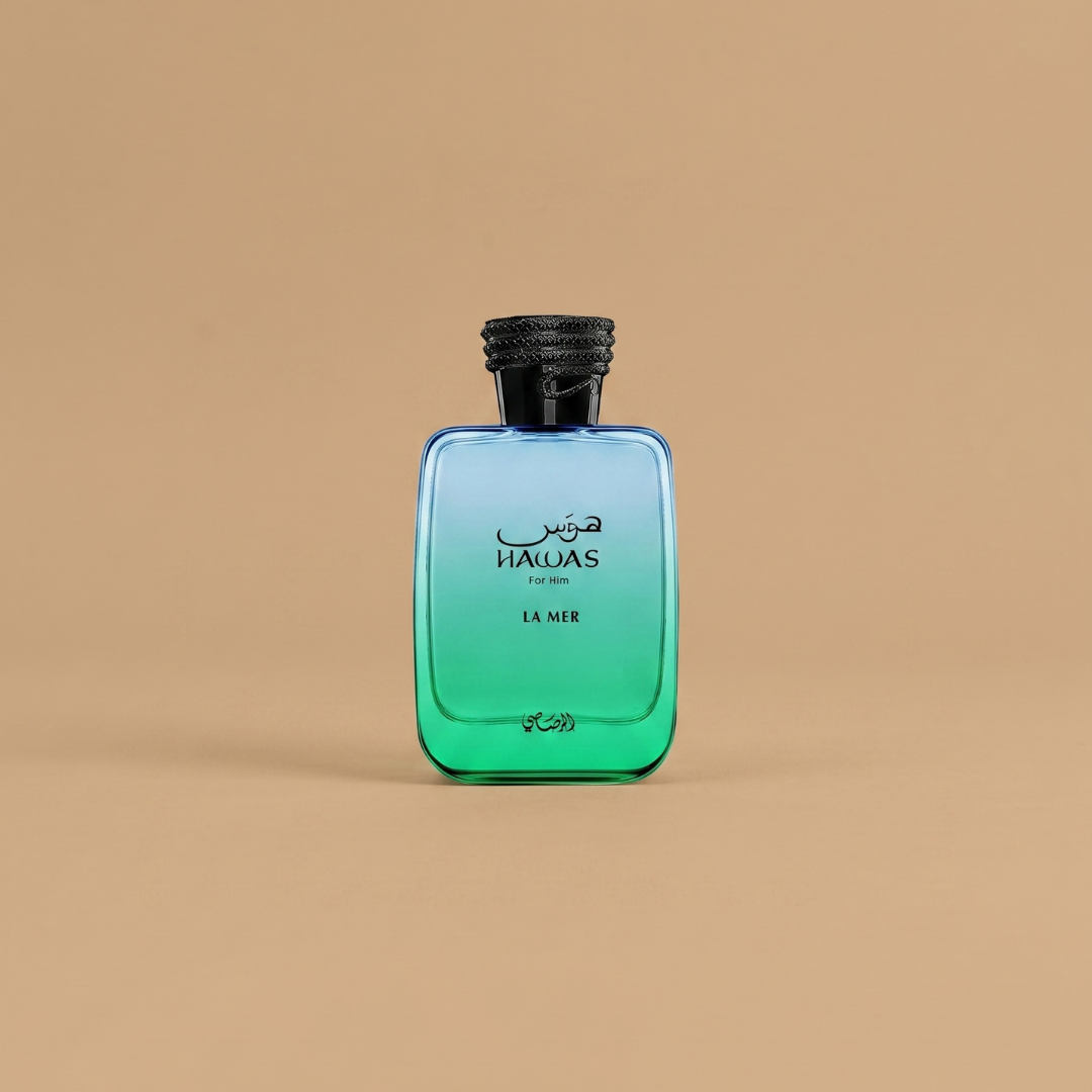 A blue and green rectangular bottle labeled “Hawas La Mer 100ml EDP - Rasasi” in English and Arabic, representing the vibrant Rasasi fragrance, stands upright against a plain beige background.