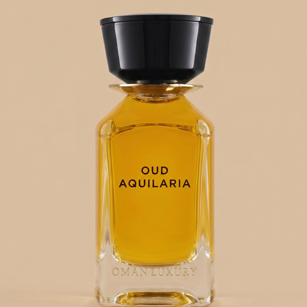 A crystal-clear 100ml bottle of OmanLuxury’s Oud Aquilaria EDP, filled with golden-hued perfume and adorned with a black cap and the “OmanLuxury” logo embossed at the base, highlights the sophisticated allure of this signature agarwood oud fragrance—set elegantly against a beige background.
