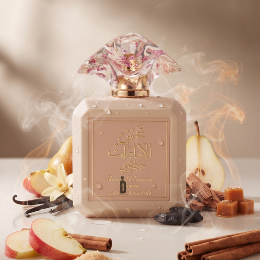 A bottle of Shams Al Emarat Khususi Glaze & Glow 100ml EDP by Ard Al Zaafaran, adorned with golden Arabic script that captures the brand’s signature elegance, is artfully surrounded by slices of apple and pear, rich caramel, cinnamon sticks, delicate vanilla flowers, and dried plums. Wisps of smoke weave through the scene, evoking a luxurious and aromatic ambiance that encapsulates the opulence of this Ard Al Zaafaran fragrance.