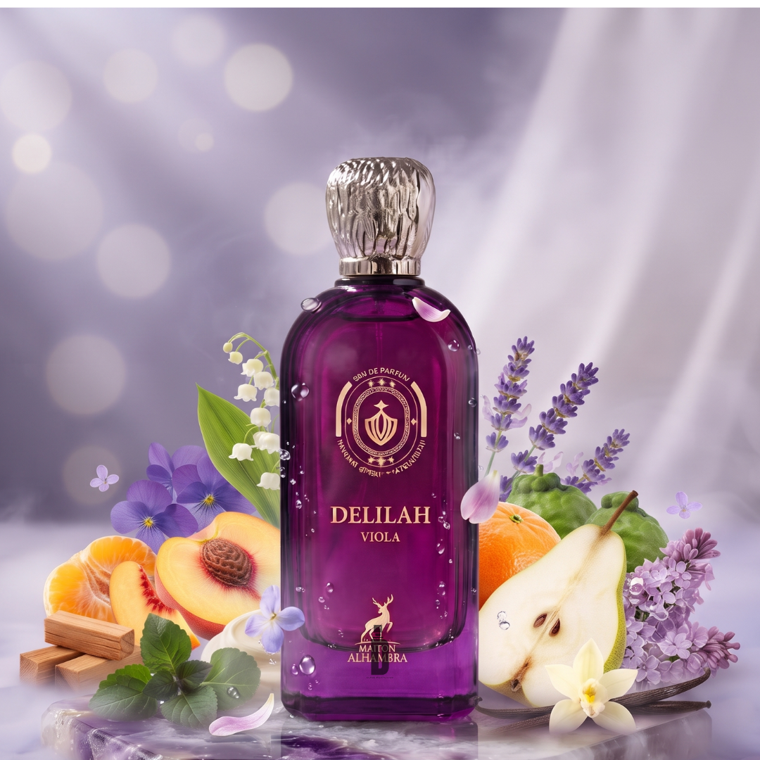A misty, dreamy background with soft light sets the scene for the Delilah Viola 100ml EDP by Maison Alhambra—a purple perfume bottle encircled by notes of peach, pear, orange, lavender, vanilla flower, cinnamon, and green leaves—perfectly evoking the essence of this floral fragrance.