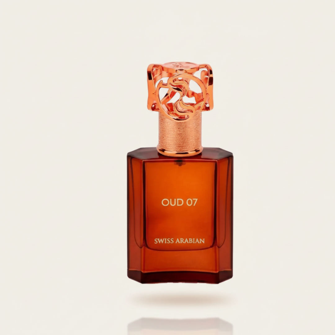 A brown, rectangular 50ml “Oud 07” EDP by Swiss Arabian stands upright with a rose gold cap, its label visible. The elegant bottle is displayed against a plain, light background.
