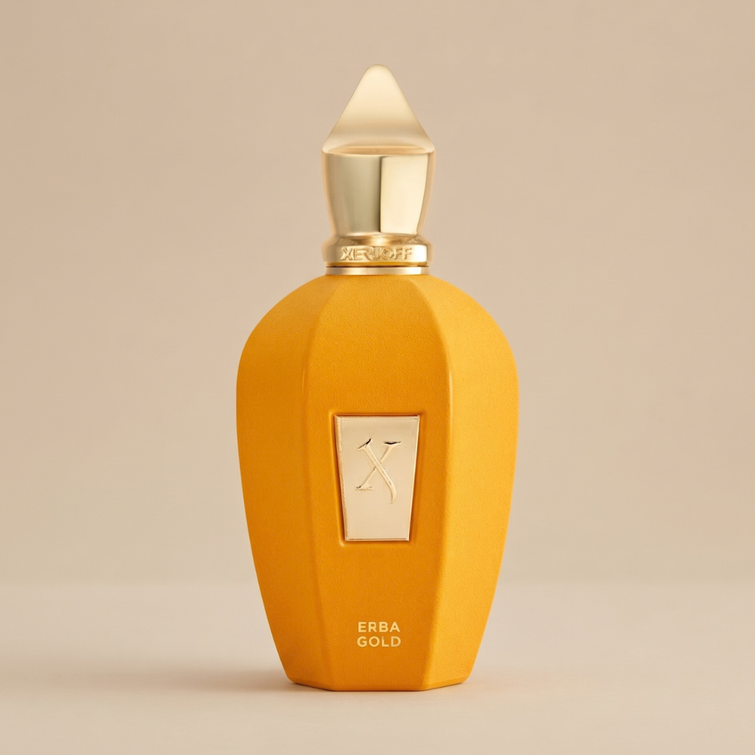 Bright yellow Erba Gold 100ml EDP - Xerjoff perfume bottle with a metallic gold stopper, a central emblem featuring the letter X, and “ERBA GOLD” printed near the base.