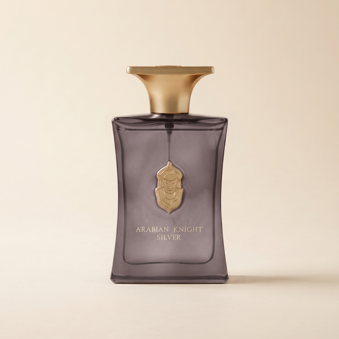 An Arabian Knight Silver 100ml EDP - Arabian Oud perfume bottle in a rectangular, translucent gray design featuring a gold-toned cap and a shield-shaped emblem.