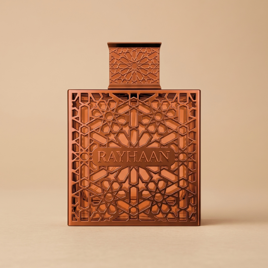 A square bottle of Vantage 100ml EDP - Rayhaan, featuring a spicy, woody fragrance in a warm bronze finish with an intricate lattice pattern and a matching square cap.