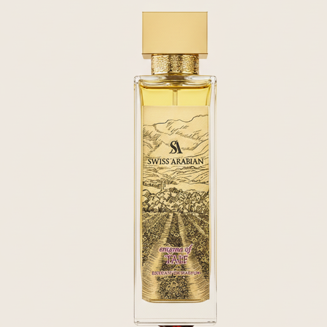 The Enigma Of Taif 100ml EDP by Swiss Arabian comes in a rectangular glass bottle with gold liquid, a square gold cap, and a detailed gold label, offering a luxurious scent inspired by Taif rose and featuring an illustrated landscape.
