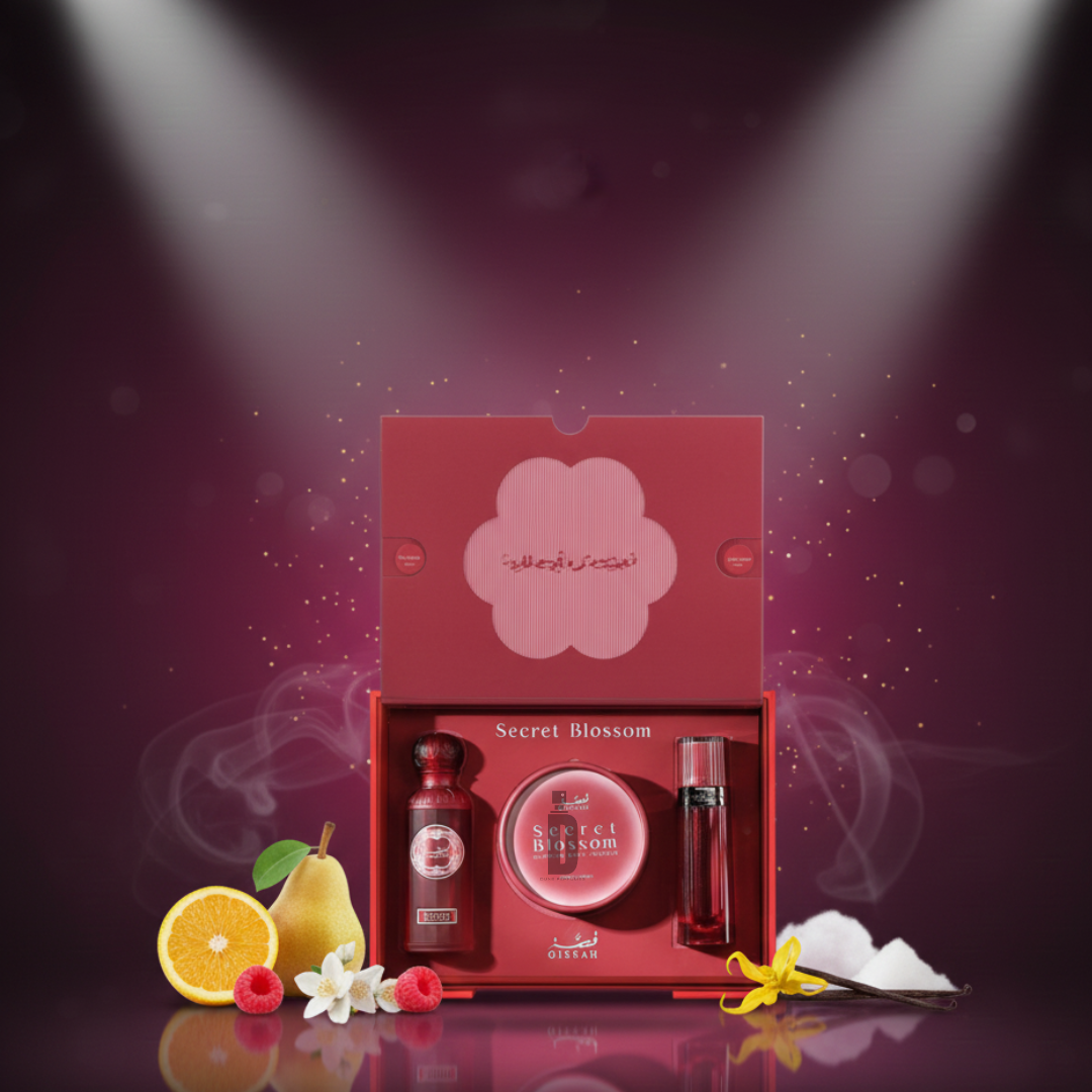 The Secret Blossom Set by Gissah is a luxurious gift box with floral perfume, cream, and spray, shown amid fruit, vanilla, and flowers on a dramatic background with pink sparkles and smoke.