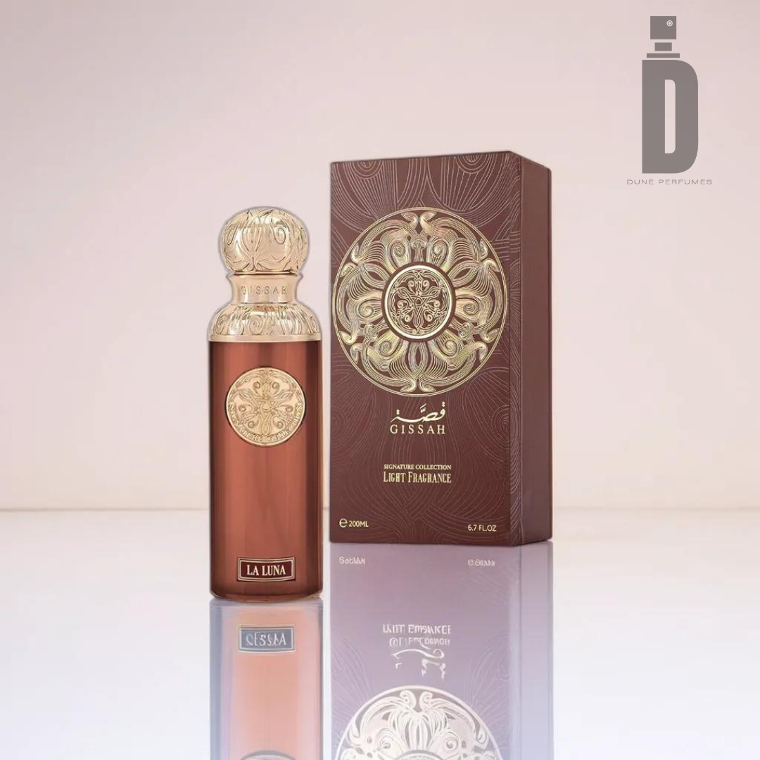 A perfume bottle labeled "La Luna" and an accompanying matching ornate box, both intricately designed with gold and bronze patterns. Perfect for evening wear, the "Gissah" brand name and a volume of "200ml" are prominently displayed on each, promising a captivating fragrance within.