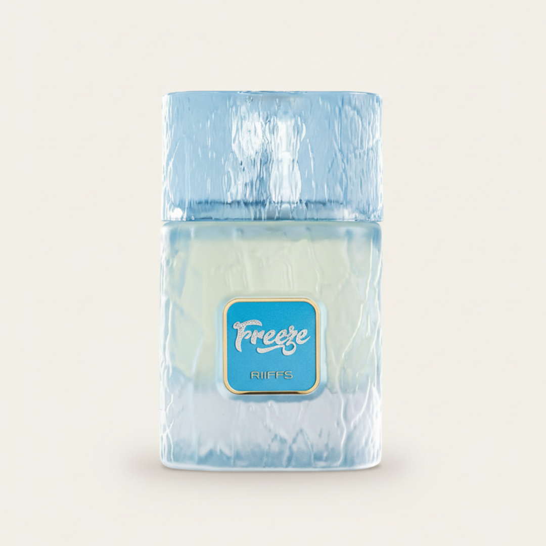 The Freeze 100ml EDP by Riiffs features an icy blue frosted bottle with a blue square label reading "Freeze" and "Riiffs," beautifully reflecting its fresh, cool essence against a plain, light background.