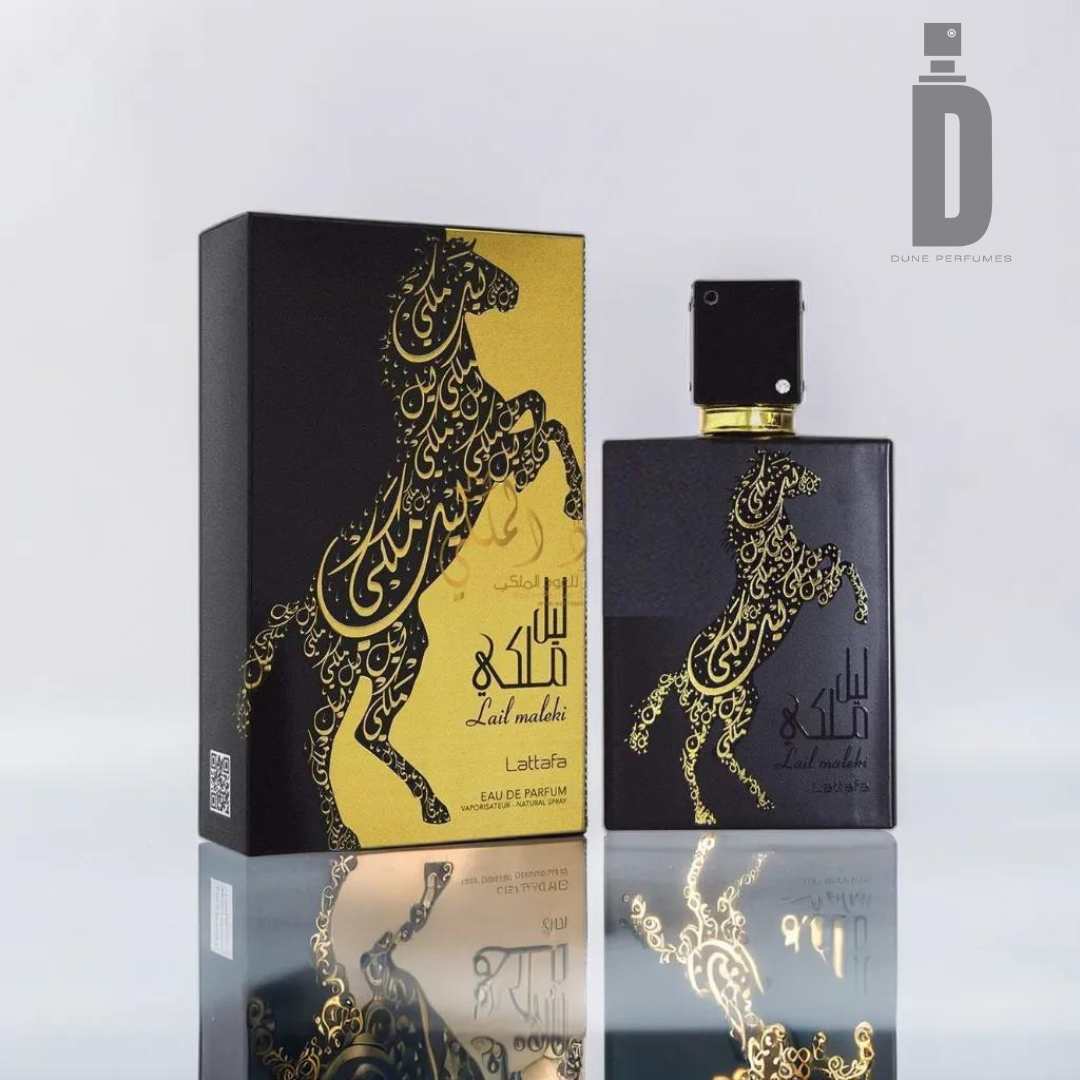 A perfume bottle and its box are displayed. The black box, adorned with a gold horse design featuring intricate patterns, matches the black bottle with a similar gold design. Both items prominently display the text "Lail Maleki 100ml EDP - Lattafa." This luxurious fragrance by Lattafa exudes sophistication and elegance.