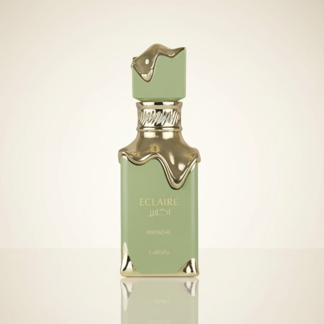 A green, rectangular 100ml Eclaire Pistache EDP bottle by Lattafa, featuring gold accents and a molten gold cap, is set against a pale gradient backdrop, evoking the allure of a pistachio-inspired fragrance.