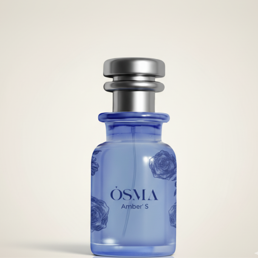 A blue glass bottle labeled "Amber S 75ml EDP - Osma," adorned with floral designs and a silver cap, suggests an amber scent by Osma, displayed on a light beige background.
