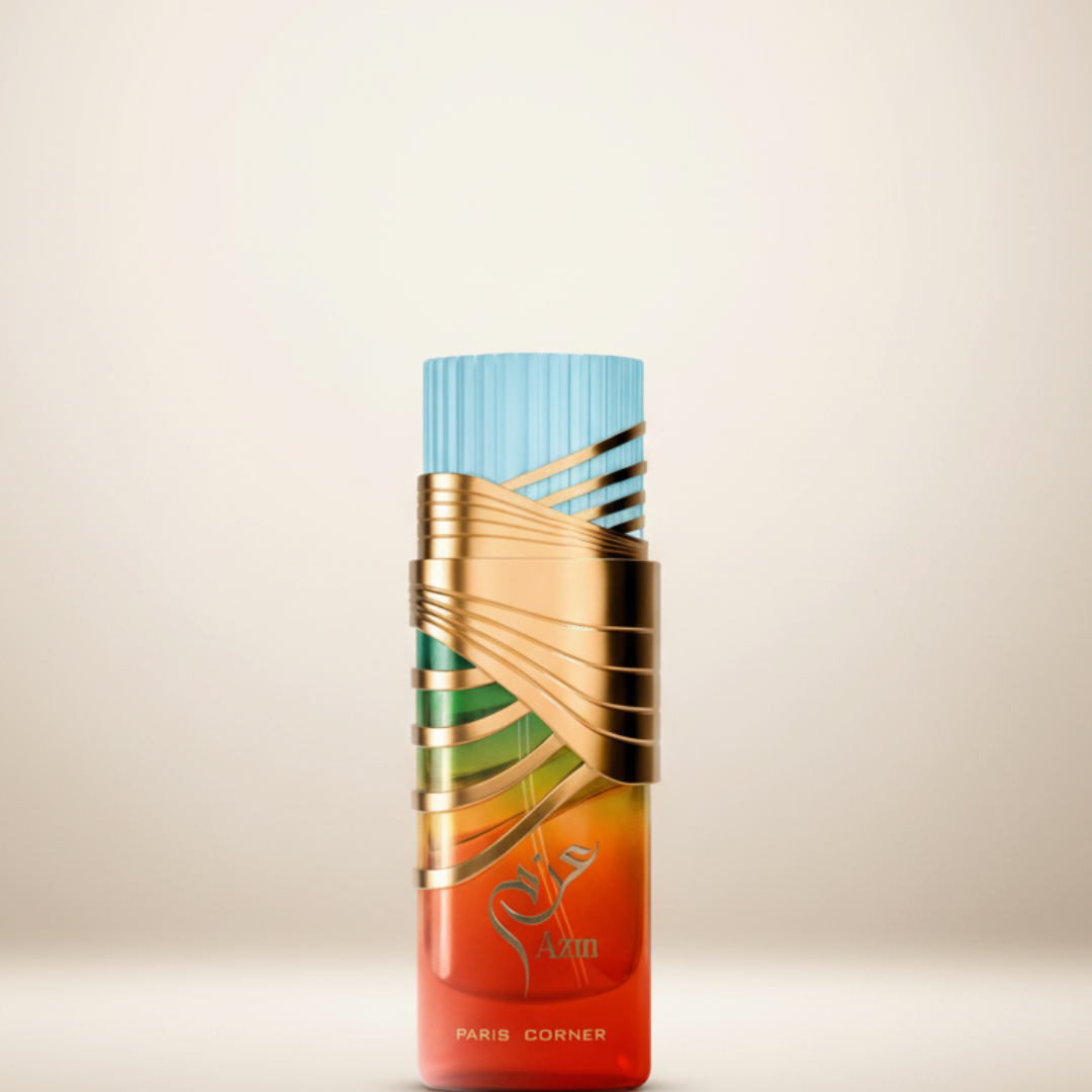 The Azm 100ml EDP by Paris Corner features a gradient orange-to-red bottle with gold metallic swirls and a light blue ribbed cap. The "Paris Corner" label and decorative script highlight its bold, luxurious perfume elegance.