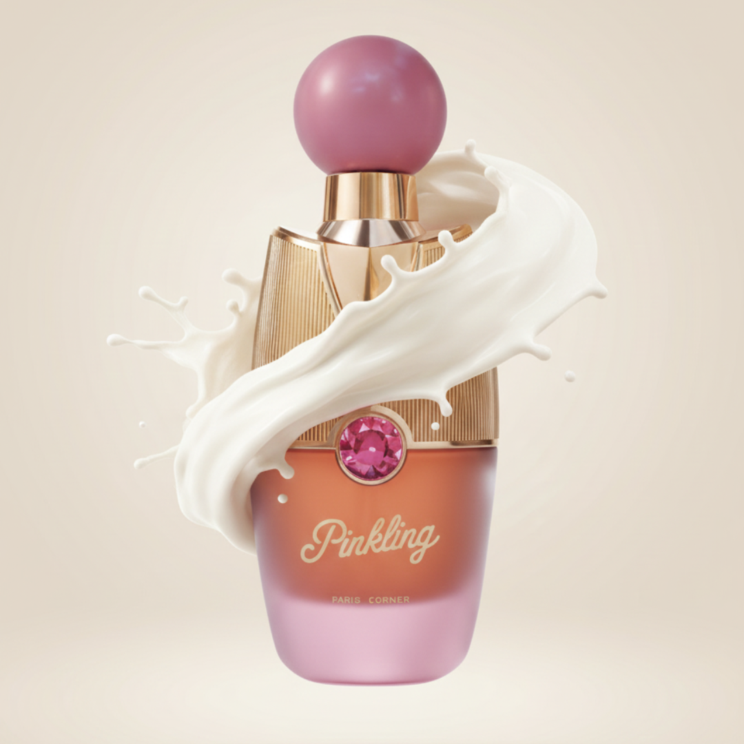 The Pinkling 100ml EDP by Paris Corner features a pink and gold bottle with a large pink cap and gemstone accent, splashed with creamy liquid on a soft beige background, evoking a playful, sweet, and seductive fragrance.