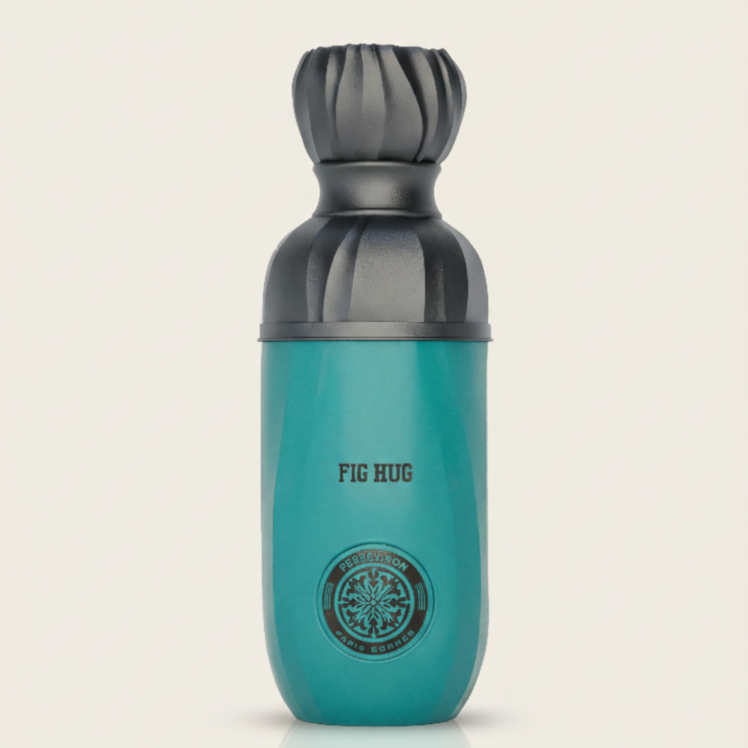 A teal bottle of Fig Hug 100ml EDP by Paris Corner features a black ornate cap and bold "FIG HUG" text above a round logo. Ideal for creamy perfume lovers, it pops against a simple, light background.