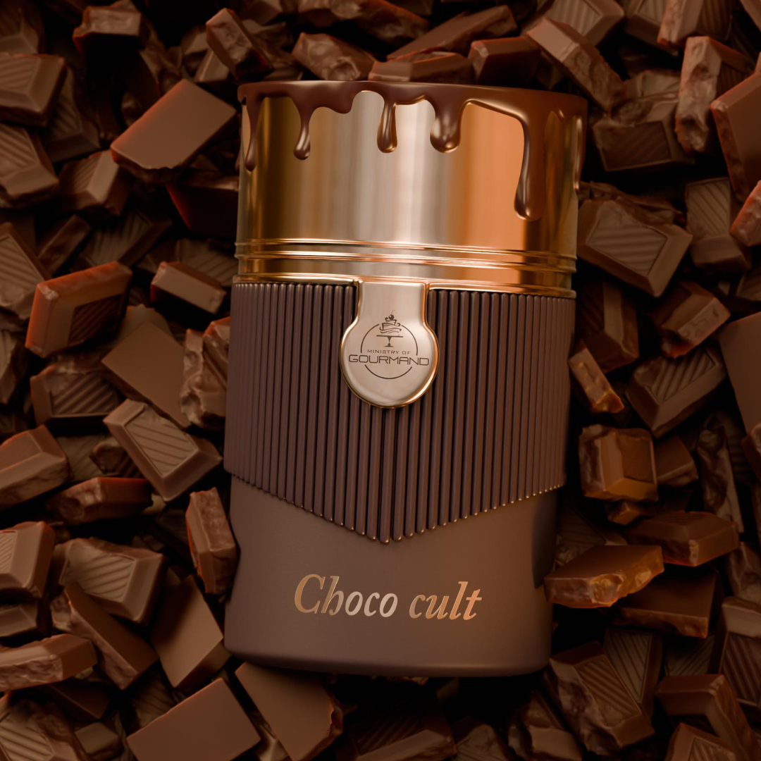 A brown and gold "Choco Cult 100ml EDP - Paris Corner" perfume bottle rests on broken chocolate pieces, its cap dripping with chocolate to hint at the rich, decadent fragrance crafted by Paris Corner.