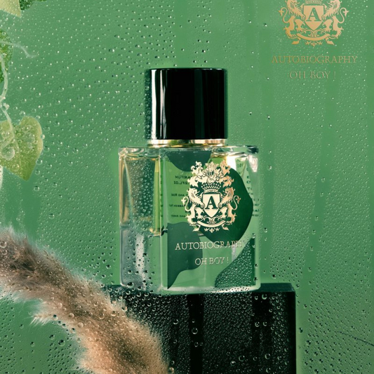 A glass bottle of "Oh Boy! 65ml EDP Autobiography - Paris Corner" perfume sits on a wet surface adorned with droplets of water. This fresh fragrance emits subtle hints of musk, while the greenish backdrop with a touch of leaf underscores its natural and invigorating essence.