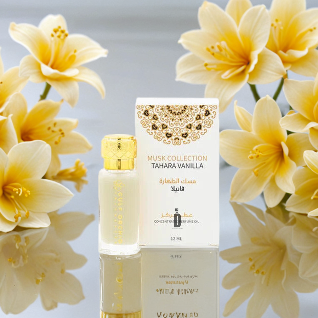 A bottle and box of Gulf Orchid's Musk Collection Tahara Vanilla 60ml EDP are showcased before soft yellow flowers on a reflective surface, emphasizing the fragrance's elegance in a fresh, inviting setting.