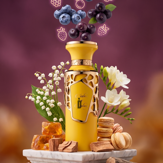 Nectar Of Ecstacy 100ml EDP by Fragrance World—a luxurious yellow bottle with gold accents—rests on marble among white flowers, macarons, caramel, wood, and floating berries, evoking a sweet gourmand scent against a glowing purple background.