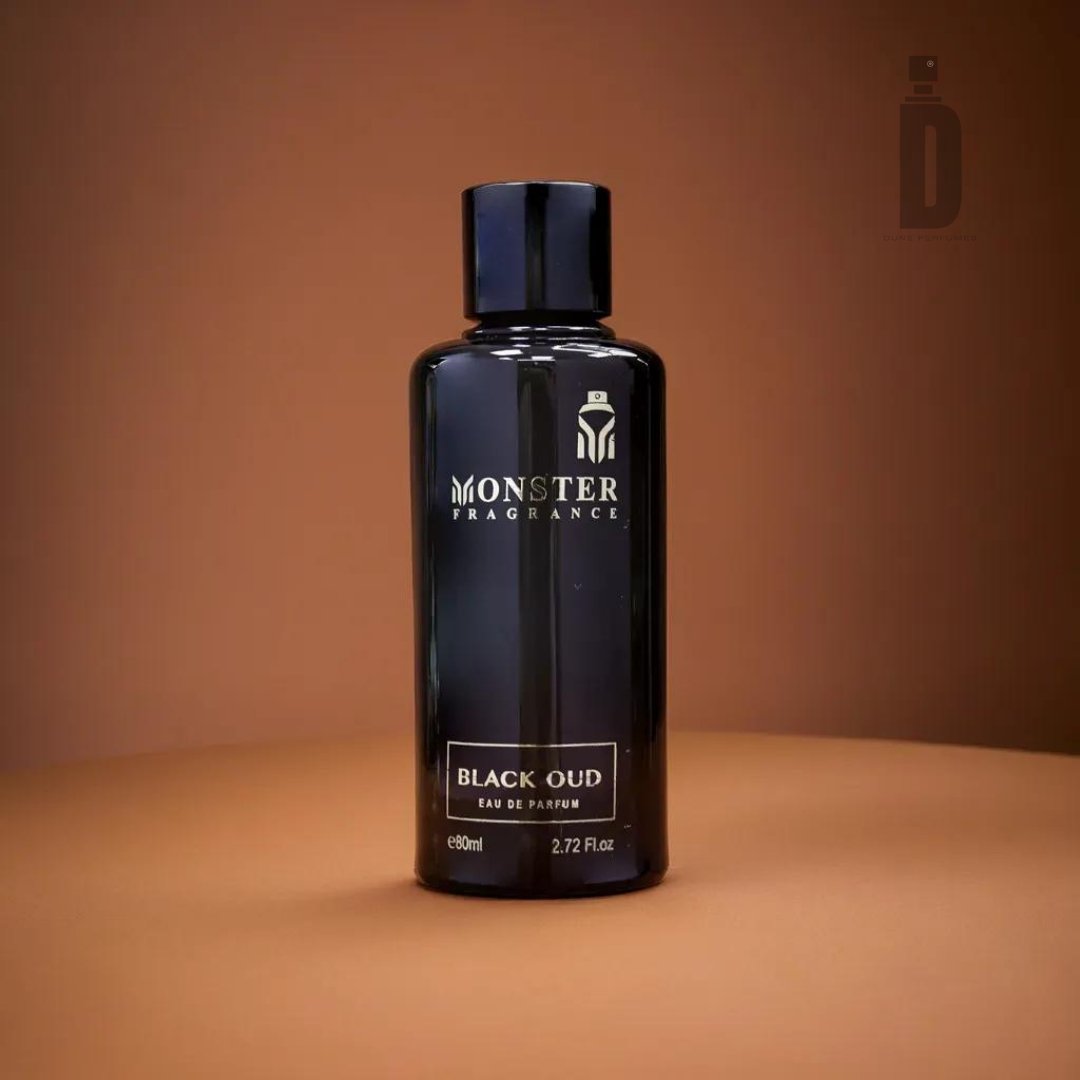 A sleek, black bottle of Paris Corner Black Oud 80ml EDP stands against a brown gradient background. The cylindrical bottle, capped in black with silver text displaying the brand and product name, encapsulates the exotic richness of deep agarwood (oud) in its 2.72 fluid ounces of perfume.