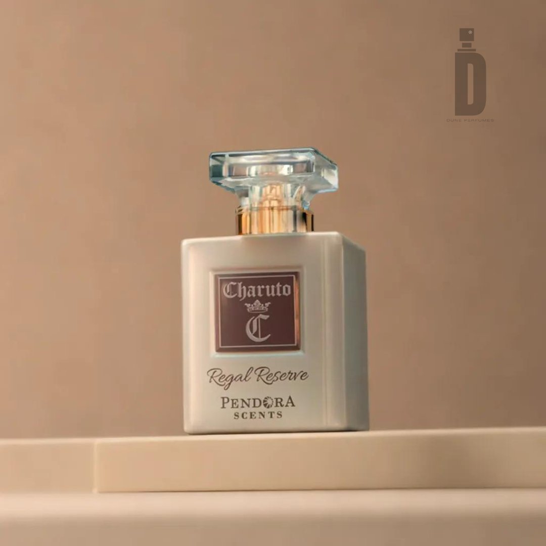 A square-shaped perfume bottle labeled "Charuto Regal Reserve 100ml EDP - Paris Corner" is placed on a beige surface. This sophisticated perfume from Paris Corner features a glass cap and a white body with a brown label. The background is a solid beige color with minimalistic design, epitomizing luxury fragrance aesthetics.