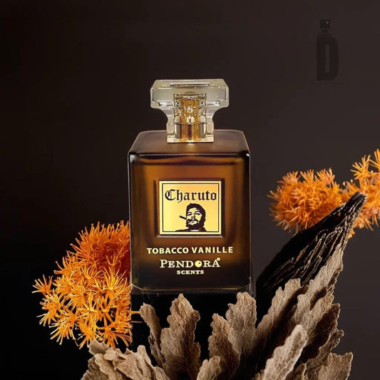 A brown glass bottle of Charuto Tobacco Vanille 100ml EDP by Paris Corner is displayed against a dark background. The bottle features an ornate, clear cap and is surrounded by vibrant orange flowers and dried leaves, adding a rustic touch to this sophisticated fragrance.