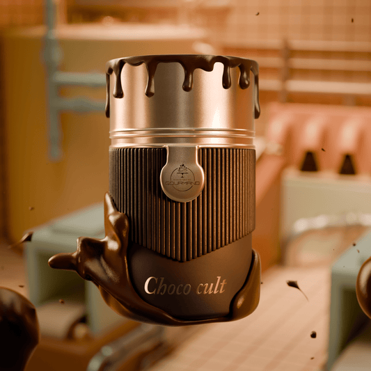 A metallic container of Paris Corner's Choco Cult 100ml EDP features melting chocolate against a warm, industrial background, capturing the decadent allure of an irresistible chocolate-inspired fragrance.