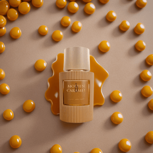 The 100ml "Molten Caramel" EDP by Paris Corner is set against a caramel-colored backdrop with glossy caramel spheres. Liquid caramel sprawls beneath, enhancing its exquisite design and evoking sweet indulgence.