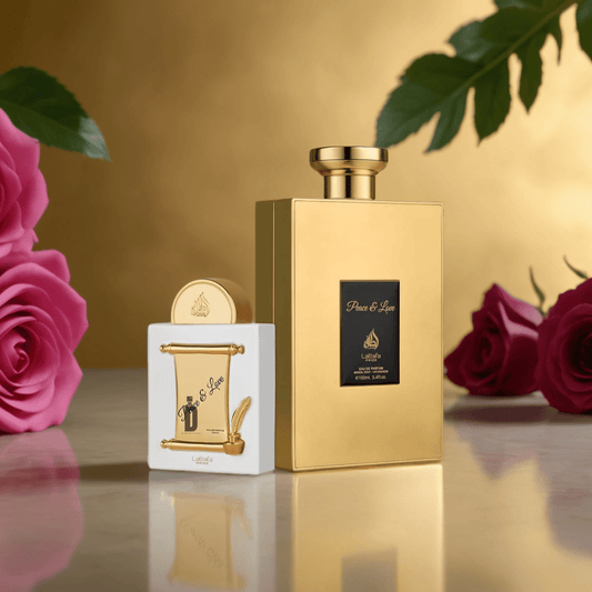A luxurious gold "Peace & Love 100ml EDP" perfume by Lattafa stands beside a matching white and gold box, surrounded by pink roses and green leaves on marble, creating an elegant floral scene with a golden backdrop.