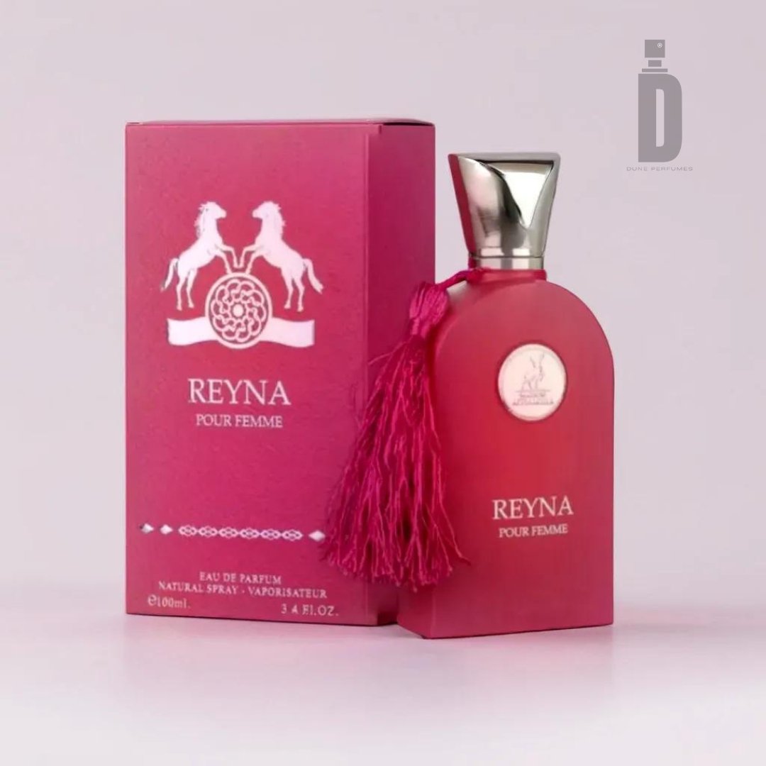 A rectangular red perfume bottle labeled "Reyna 100ml EDP - Maison Al Hambra" stands beside its matching box. The bottle, exuding regal grace, has a silver cap and a pink tassel attached. The box features two white horse illustrations and intricate design elements. The background is plain white.