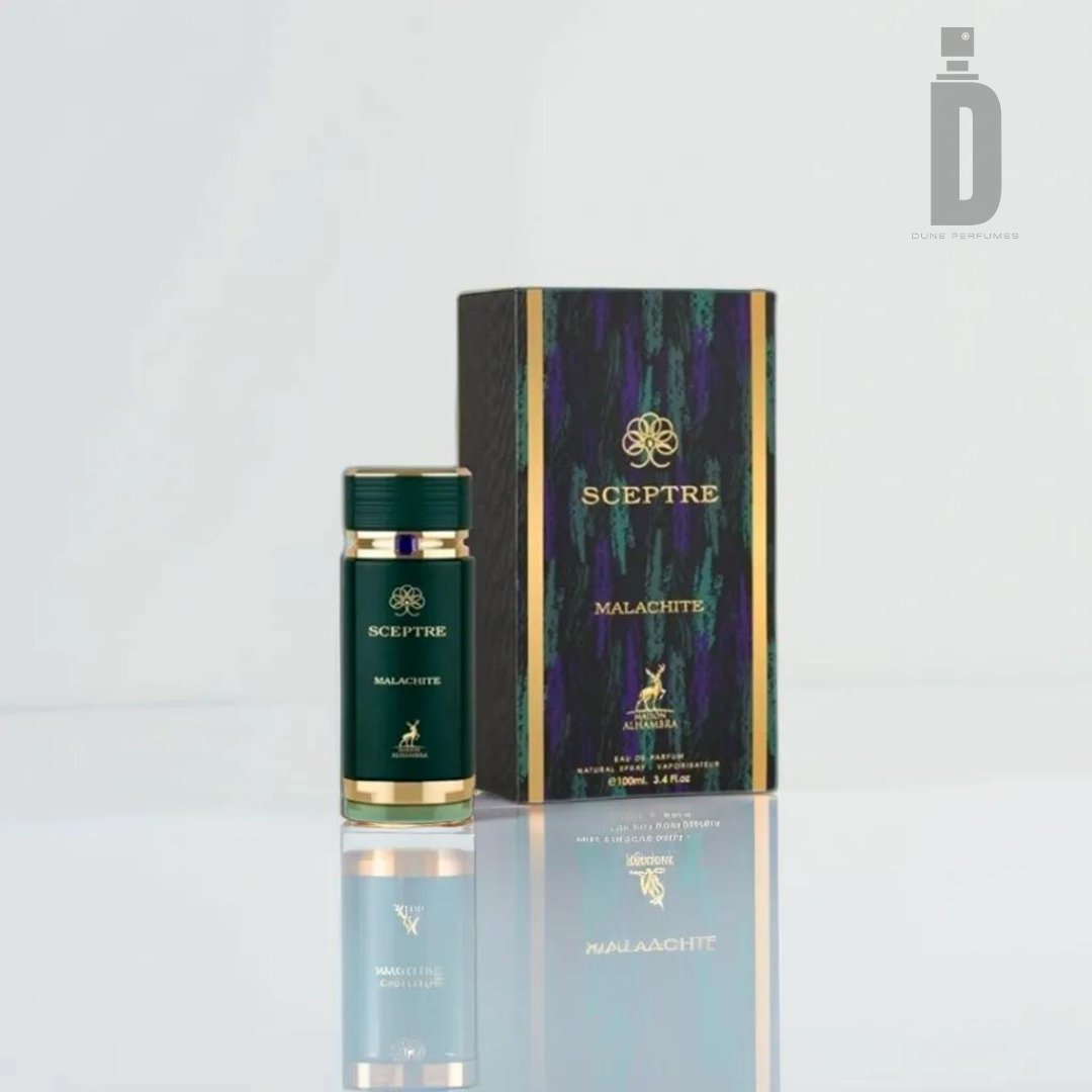 A tall, rectangular box with a green and black marble pattern showcases the Sceptre Malachite 100ml EDP from Maison Alhambra, embodying a harmonious composition. In front of the box is a matching cylindrical bottle with gold accents, reflecting on the glossy surface below. A logo and the brand name Maison Alhambra adorn both items.