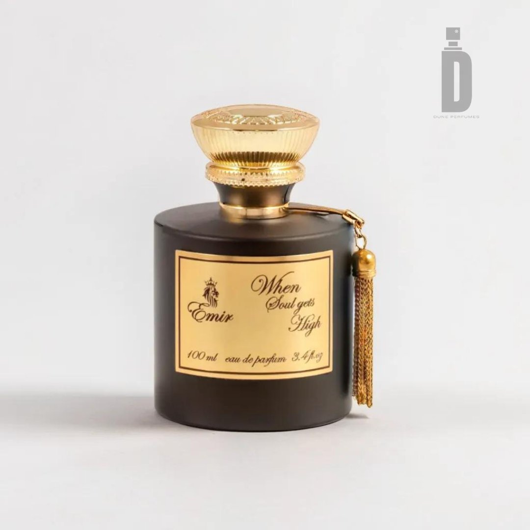 A black bottle of perfume with a gold cap and label stands against a white background. The label reads "When Soul Gets High 100ml EDP - Emir." A gold tassel hangs from the neck of the bottle, encapsulating its captivating blend. The volume is noted as 100 ml, and "eau de parfum" is stated. The product is by Paris Corner.